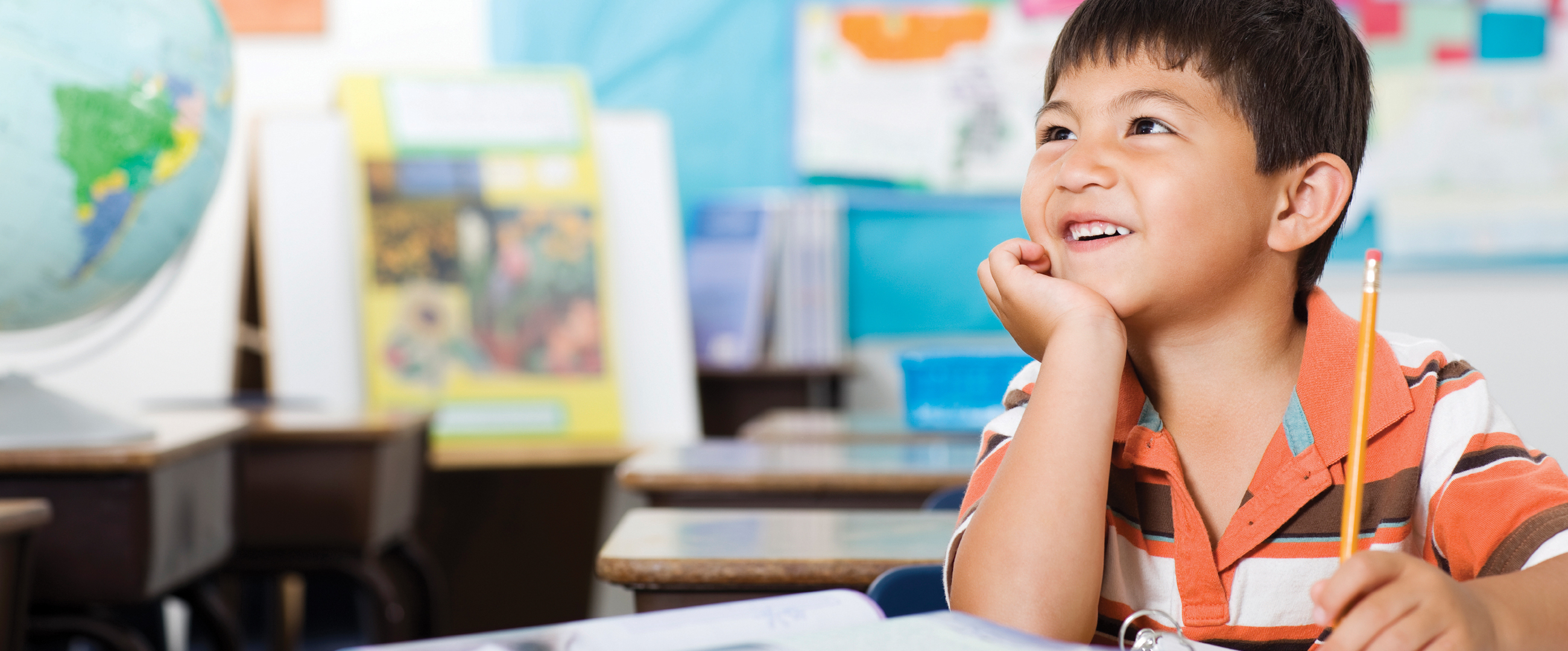 young smiling boy in classroom